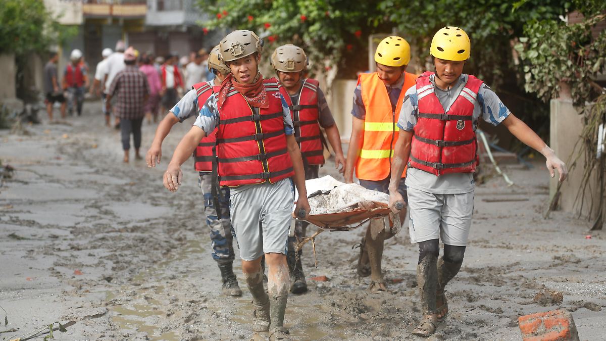 Dead and missing in flash flood: Nepal digs mass graves for unidentified ...